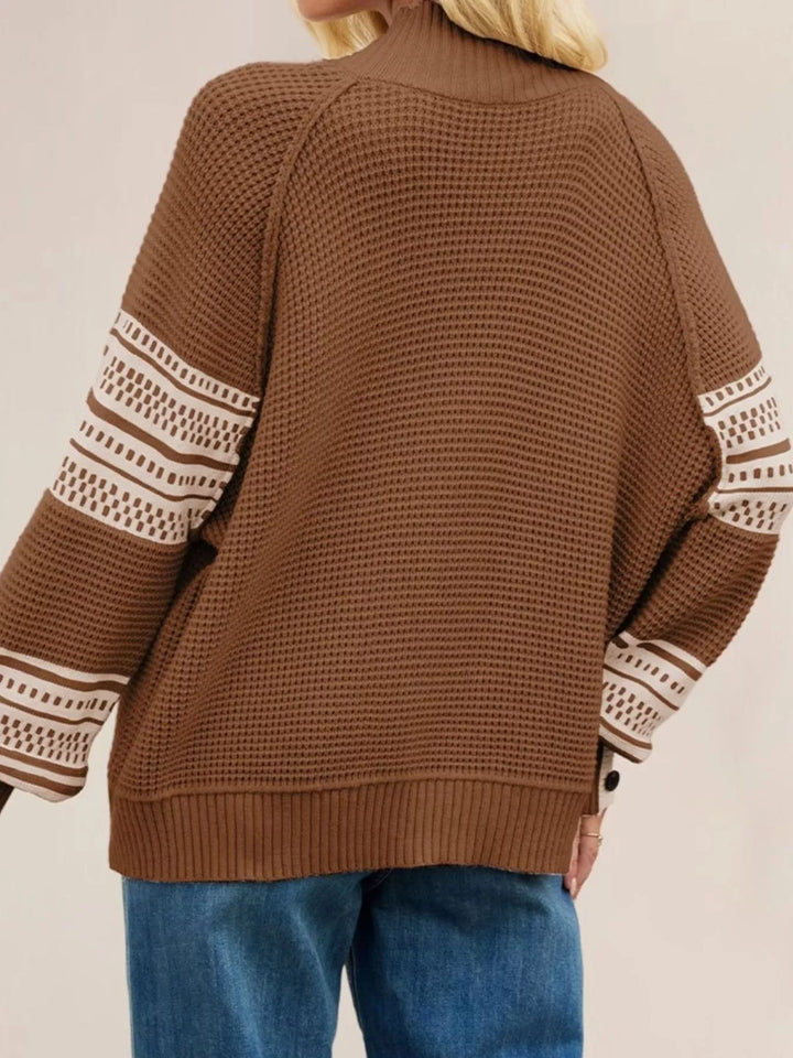 Waffle knit mock neck sweater with geometric sleeve stripes