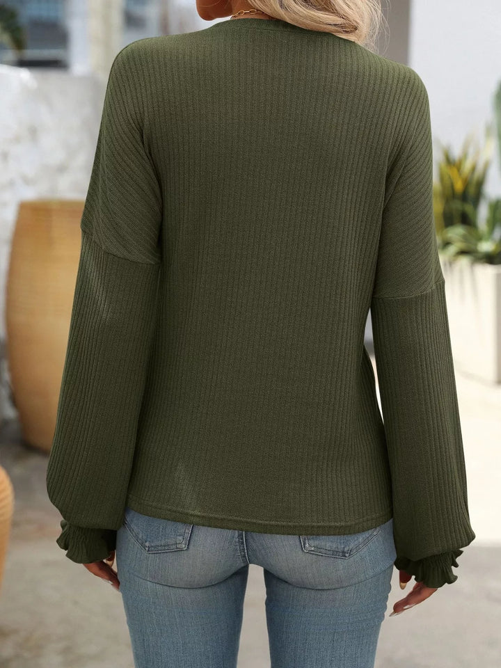 Ribbed knit crew neck top with ruffled smocked cuffs