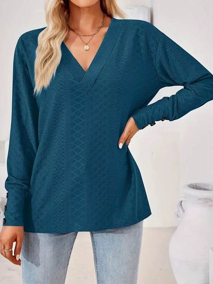 Plus size textured V-neck long sleeve top with button cuffs