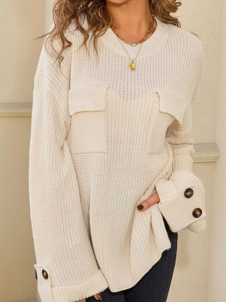 Ribbed knit sweater with chest pockets and button cuffs
