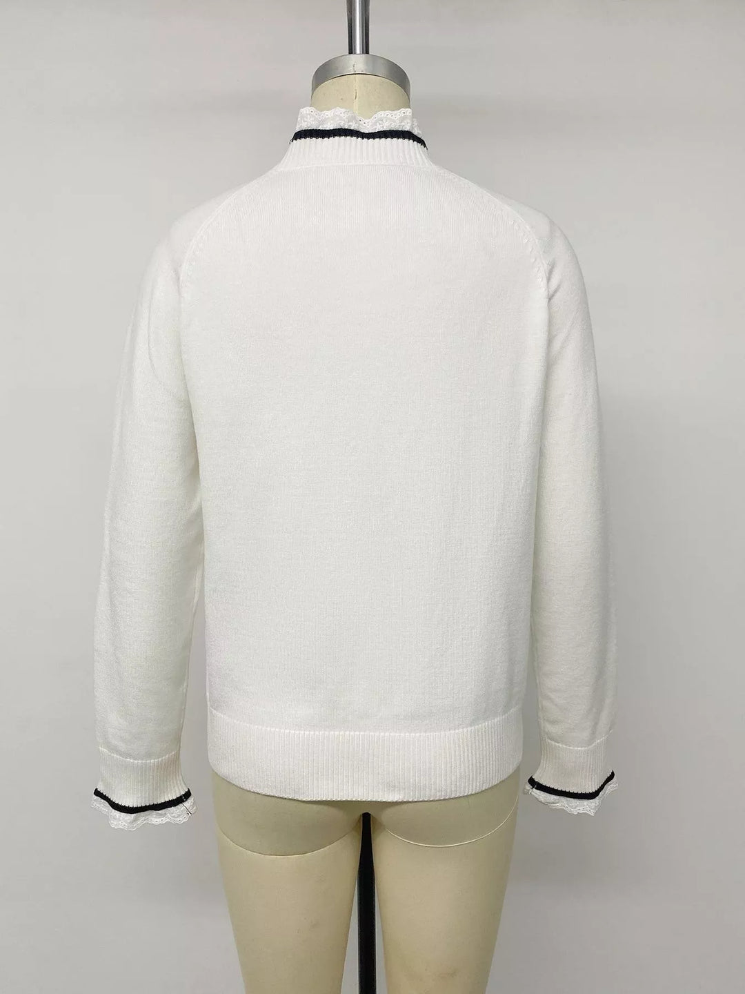 Lace trim mock neck sweater with contrast bow appliqués