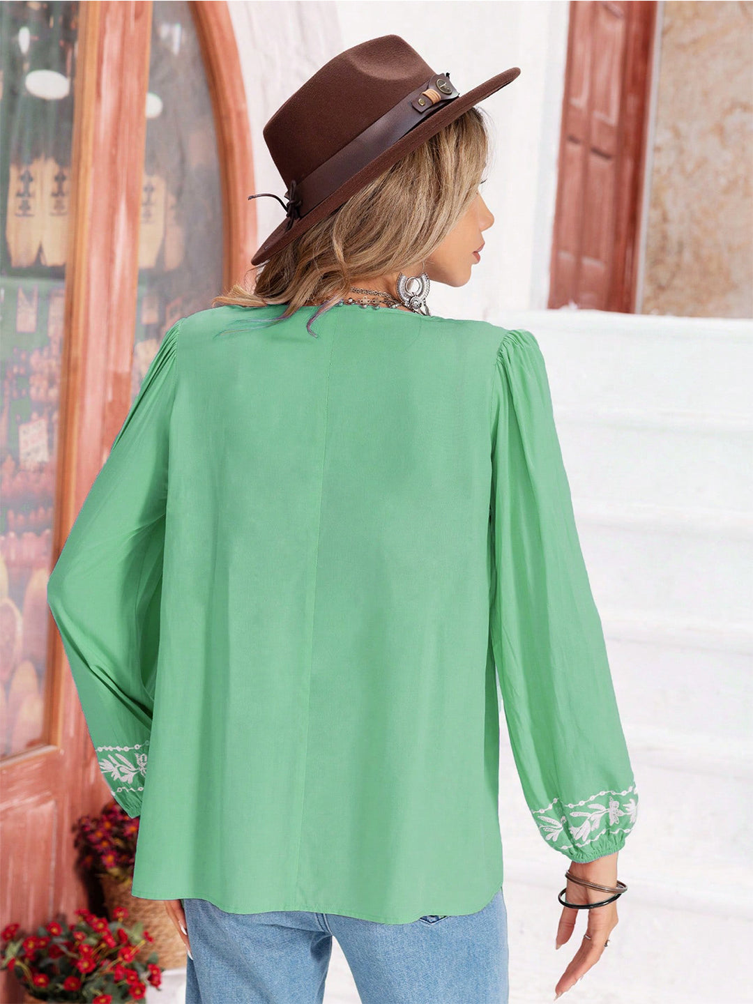 Floral embroidered tie-neck balloon sleeve blouse
