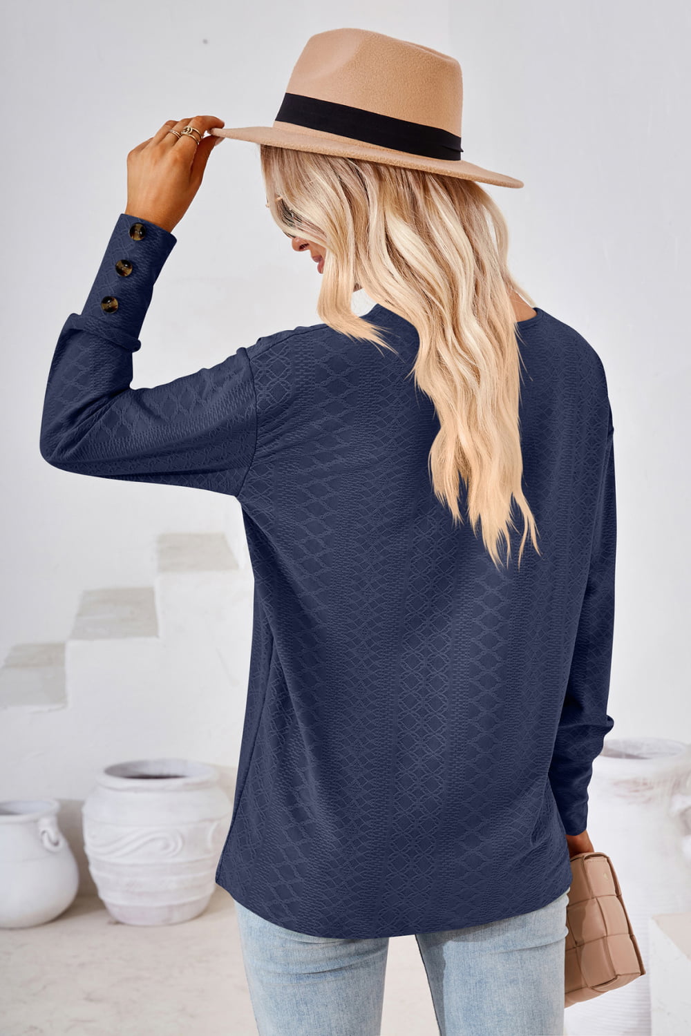 Textured knit V-neck long sleeve top with button cuffs