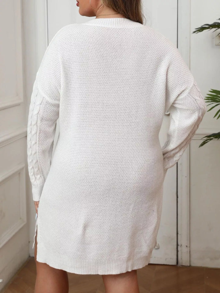 Cable knit sweater dress with contrast bow and side slits