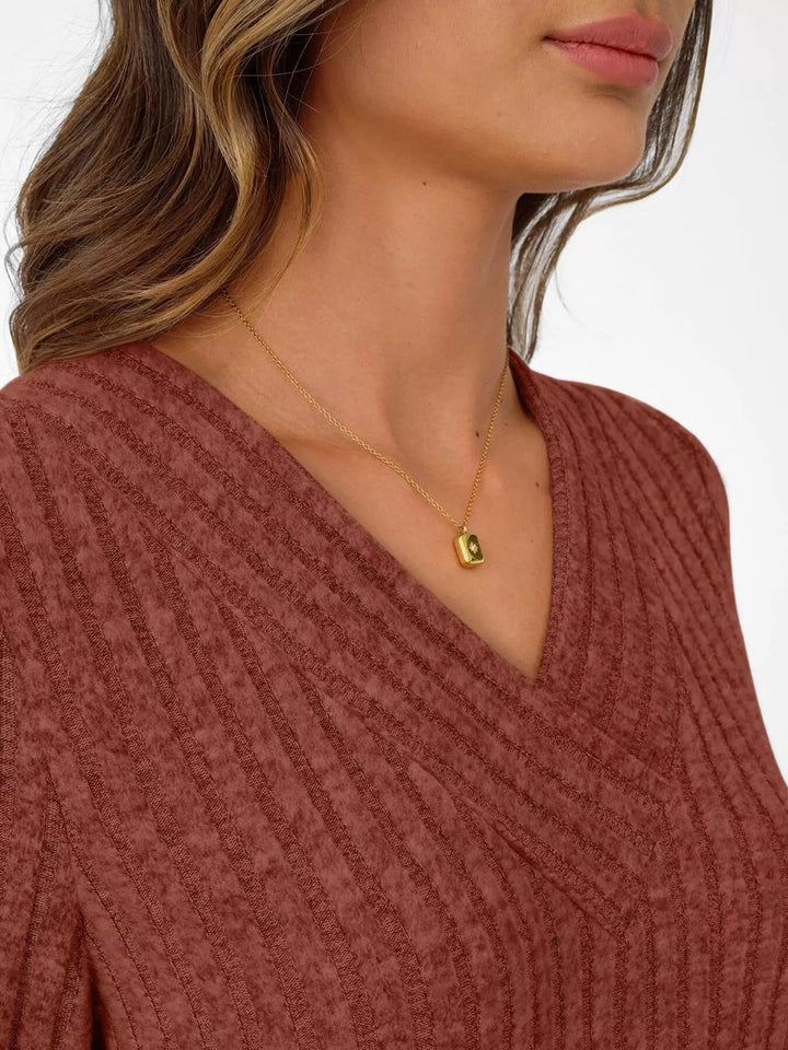 Ribbed knit v-neck top with blouson sleeves