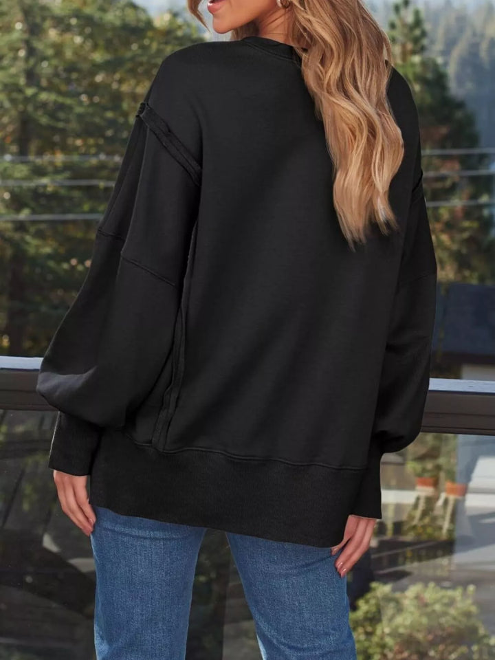 Oversized side-slit sweatshirt with exposed seams