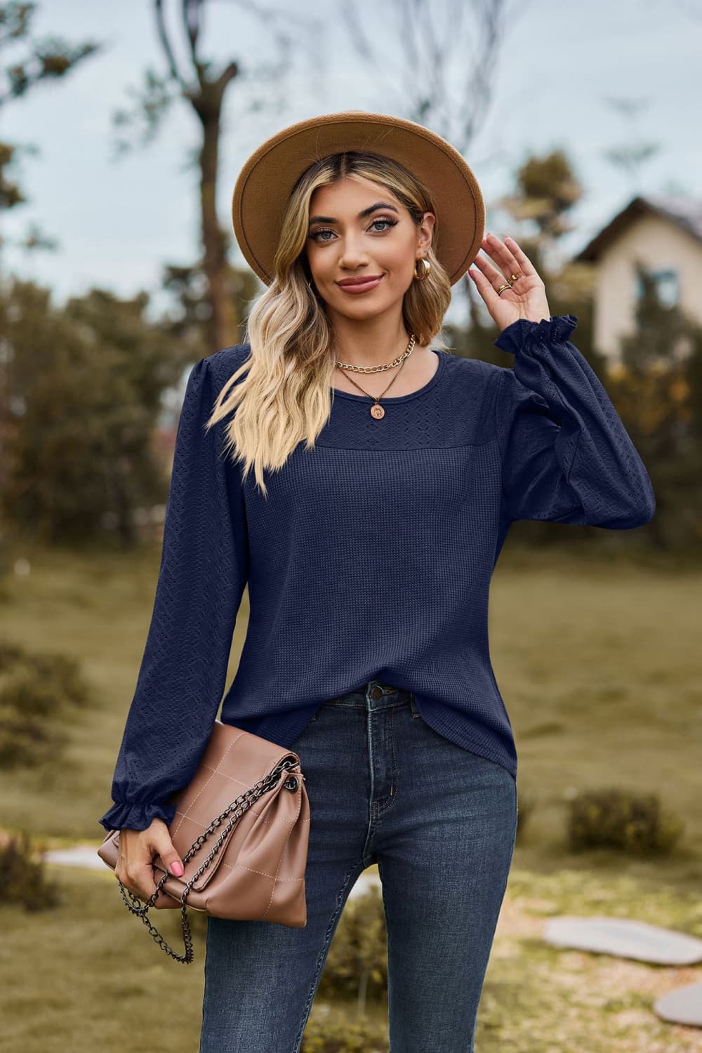 Dark Navy Eyelet knit puff sleeve blouse with round neckline