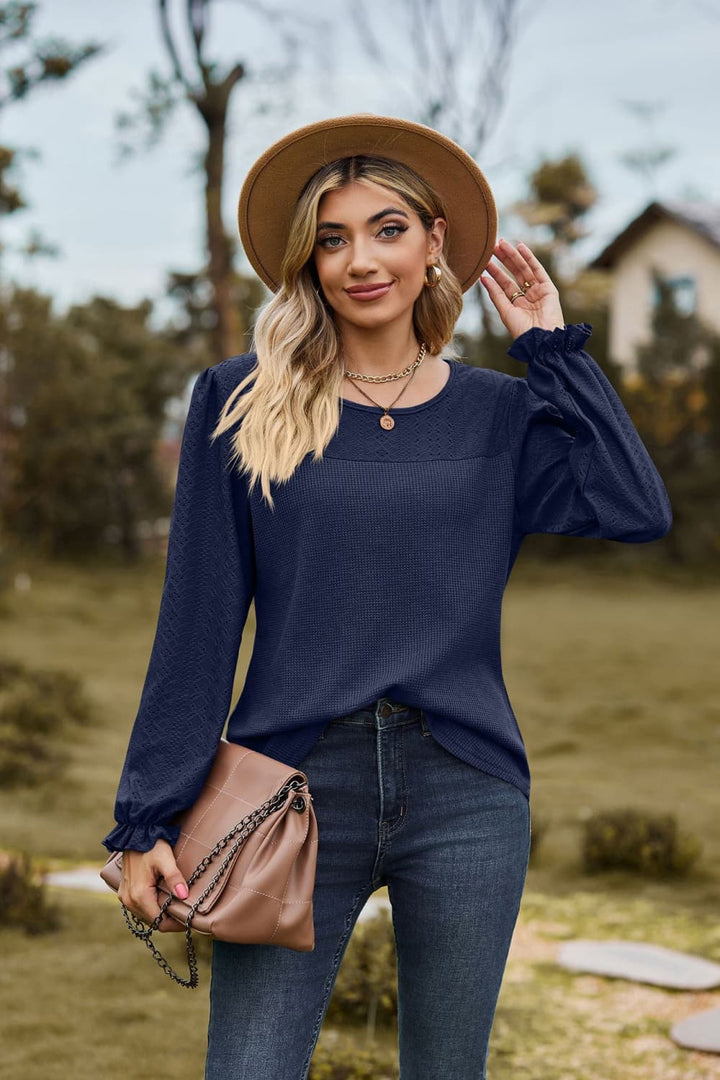 Dark Navy Eyelet knit puff sleeve blouse with round neckline