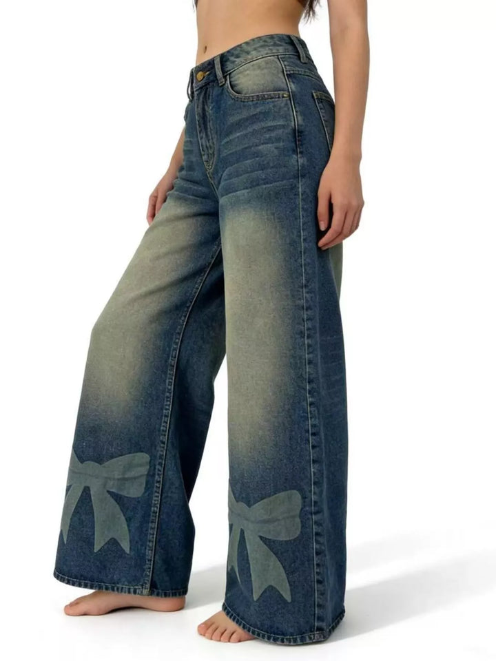 Bow-detail wide leg jeans with faded whiskering