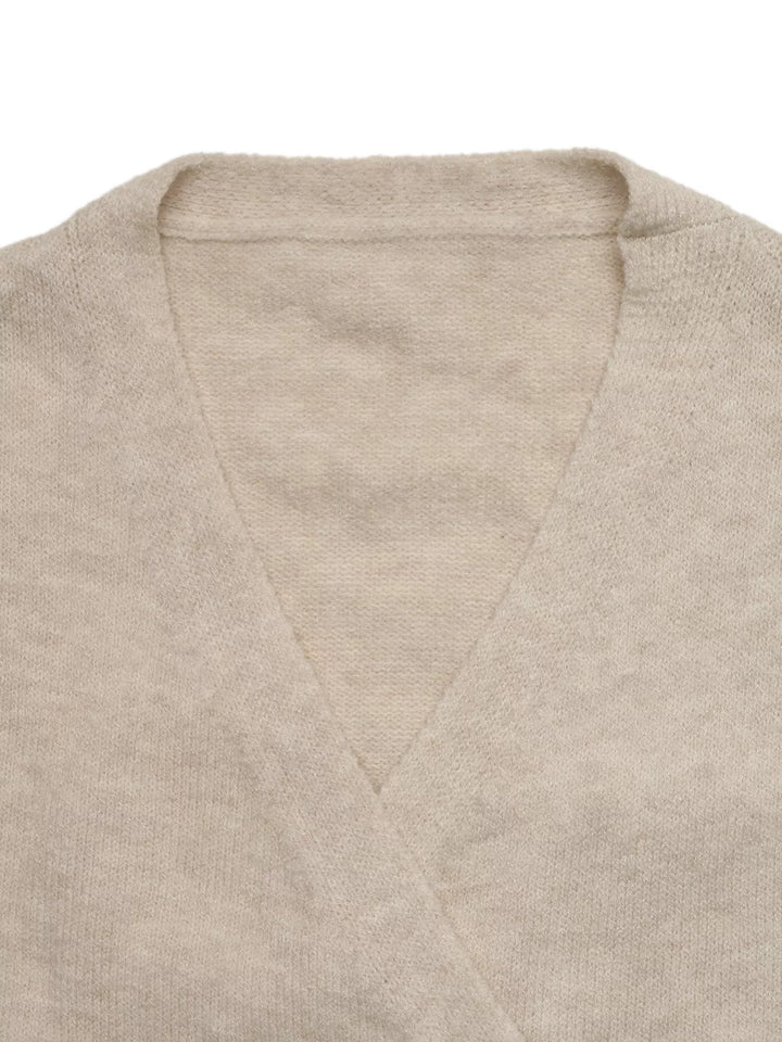 Surplice wrap sweater with side tie and drop shoulders
