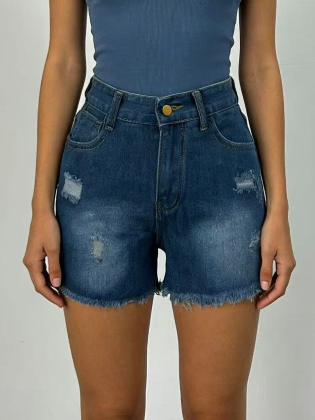 Distressed high-rise denim shorts with frayed raw hem