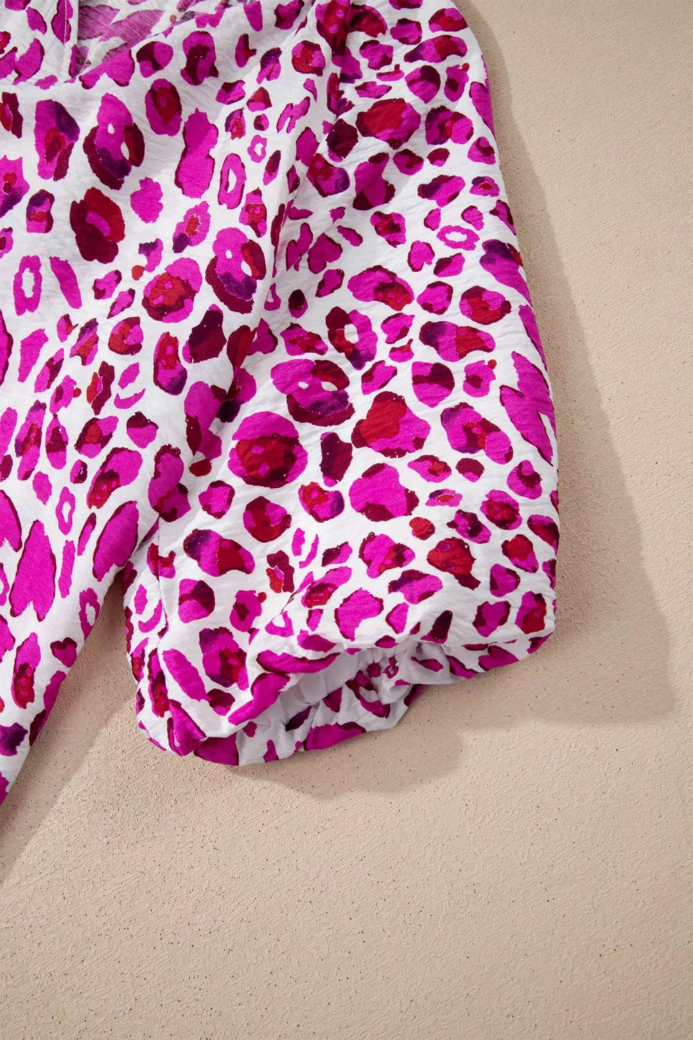 Leopard print V-neck blouse with puff sleeves