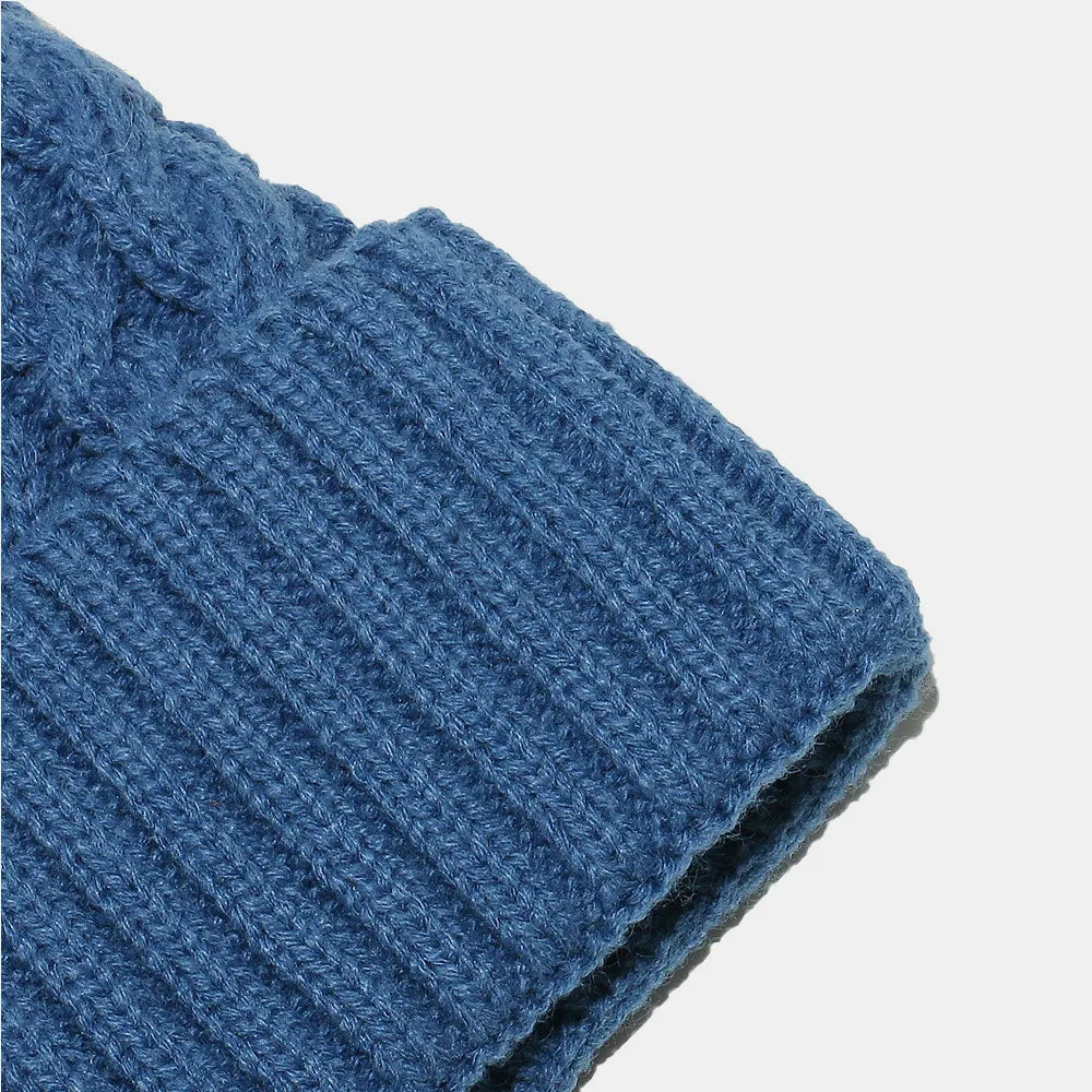Braided cable knit pompom beanie with fold-over cuff