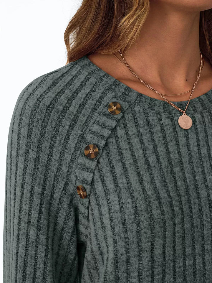 Ribbed knit long sleeve top with decorative shoulder buttons