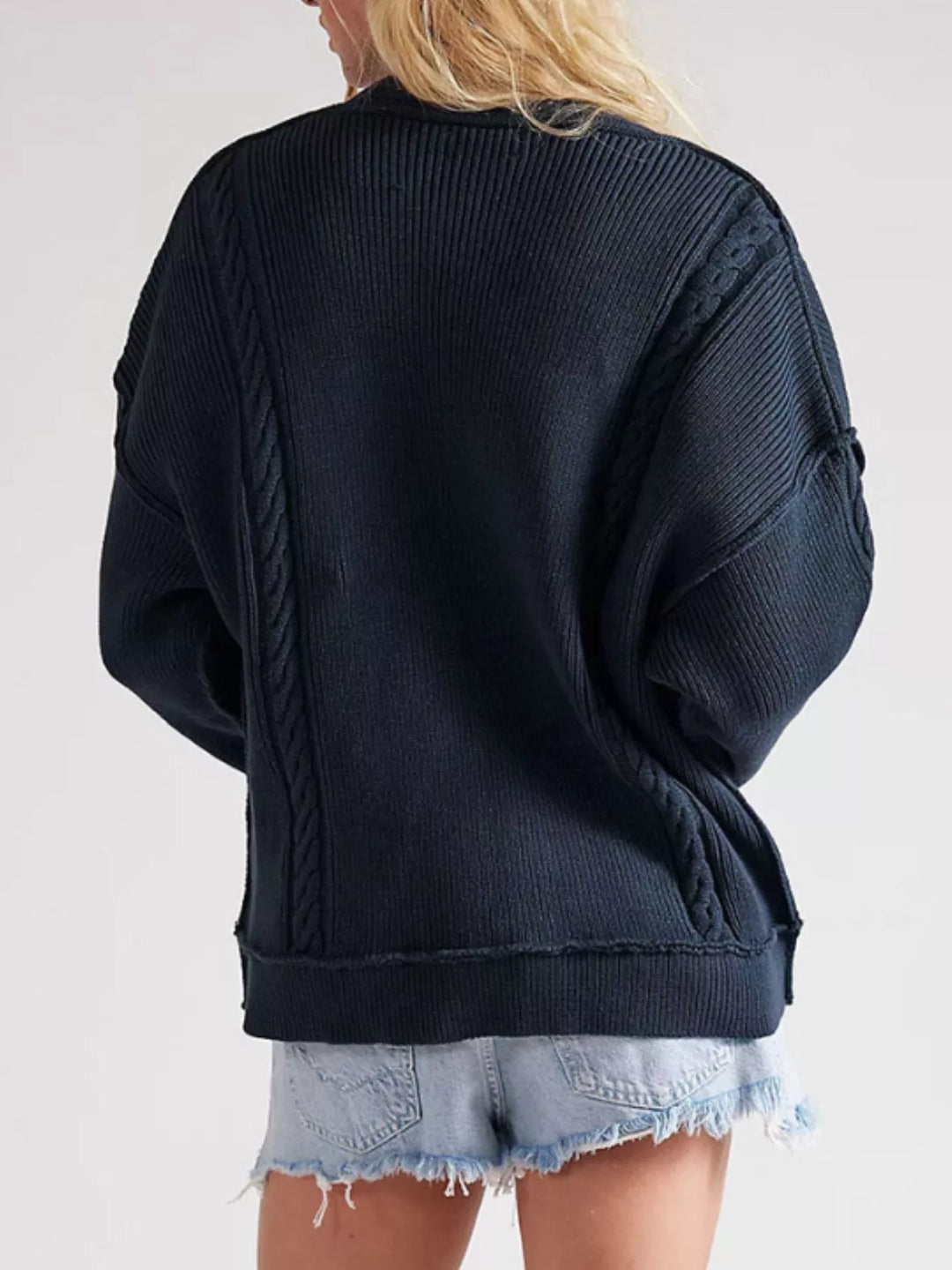Double-breasted cable knit cardigan with raw hem