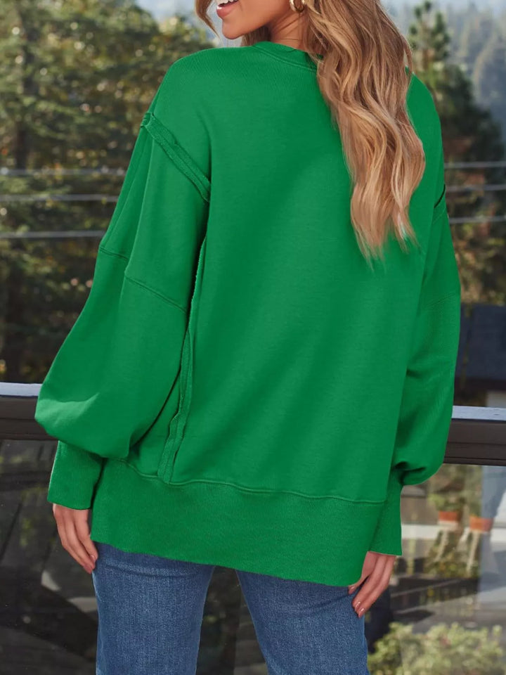 Oversized side-slit sweatshirt with exposed seams