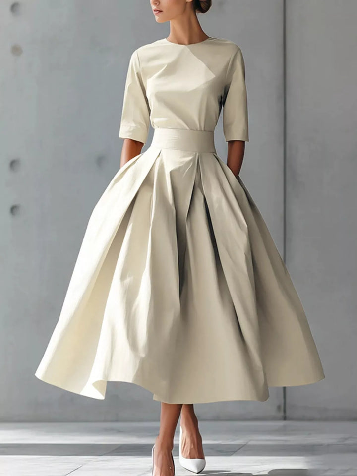 White A-line pleated midi dress with side pockets
