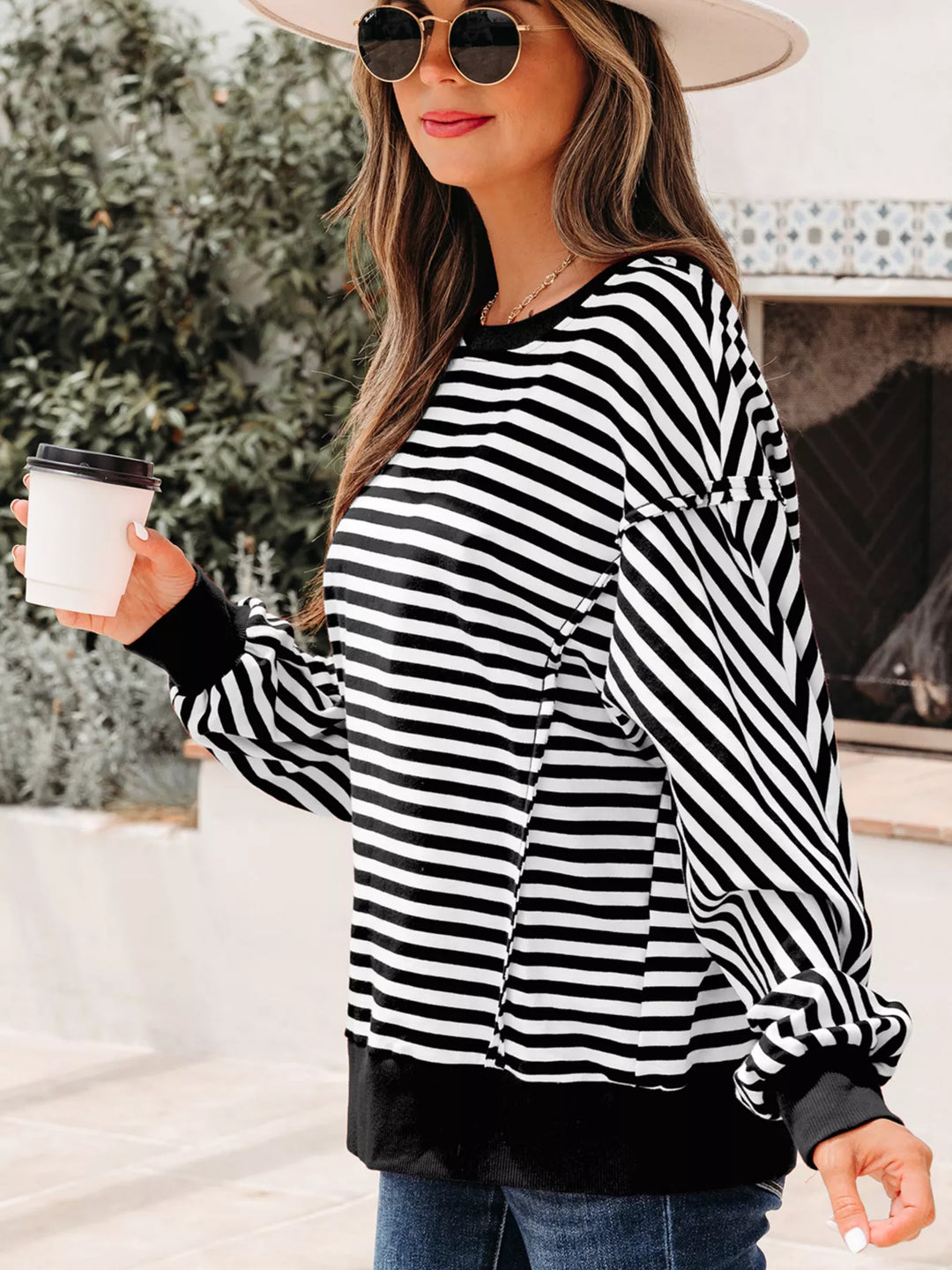 Exposed seam striped drop-shoulder pullover top