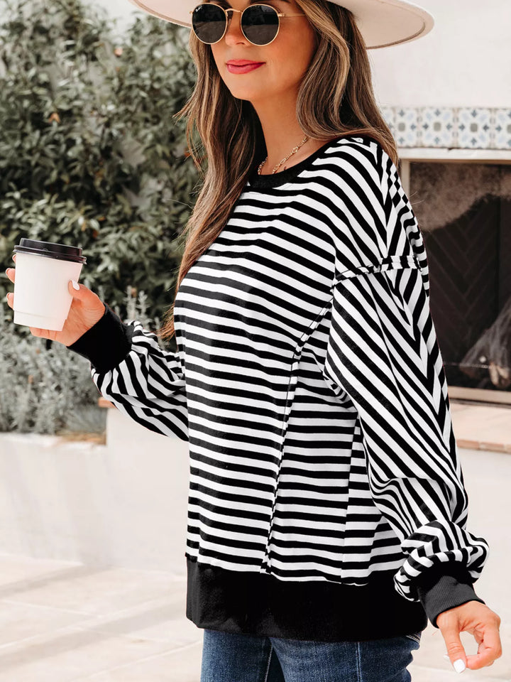 Exposed seam striped drop-shoulder pullover top