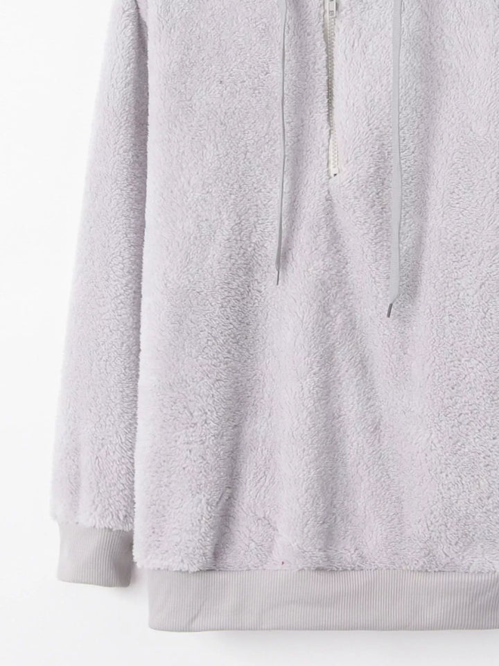 Plush half-zip fleece hoodie with drawstring hood and pockets