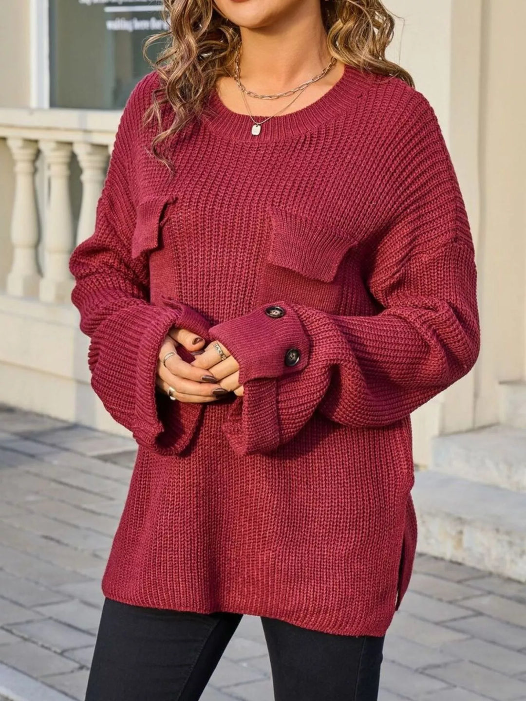 Ribbed knit sweater with chest pockets and button cuffs
