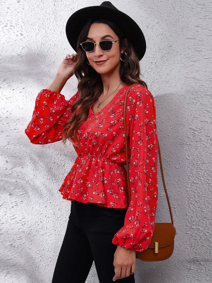 Floral peplum blouse with V-neck and balloon sleeves