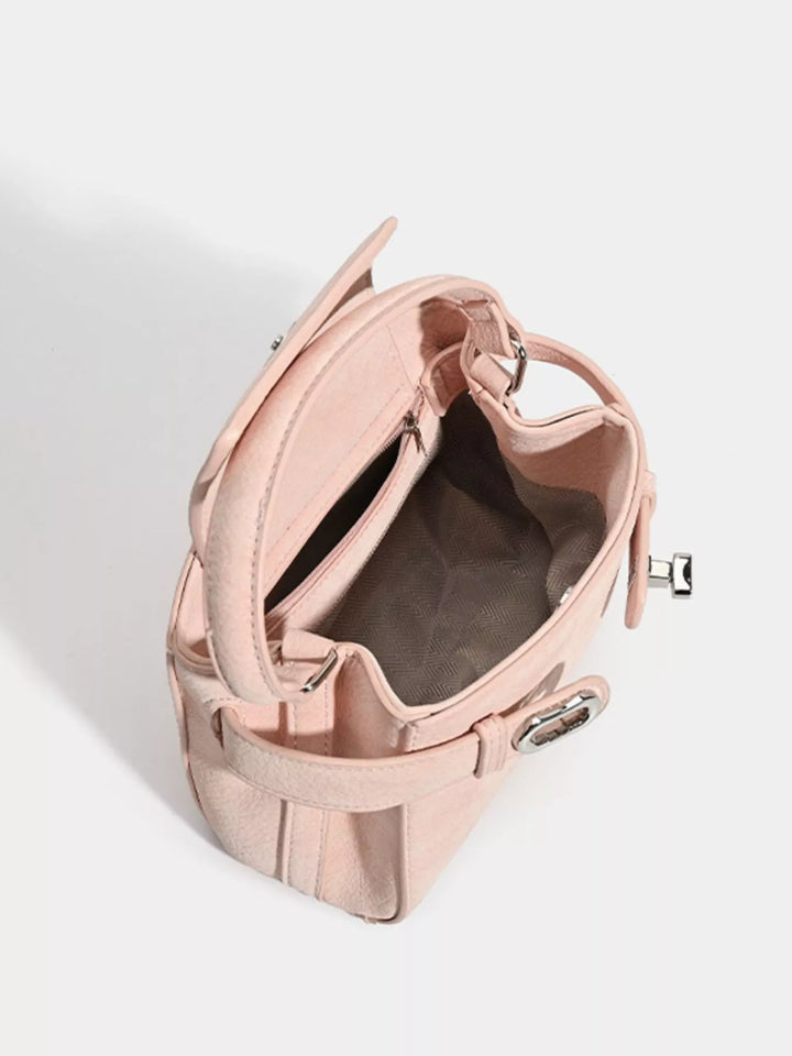 Mini belted crossbody bag with top handle and twist lock
