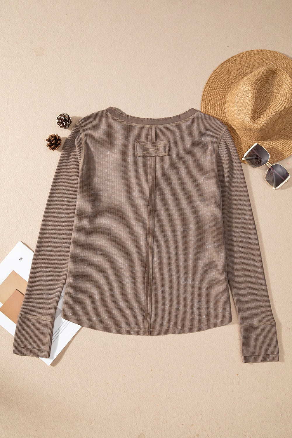 Waffle knit henley top with long sleeves and button placket