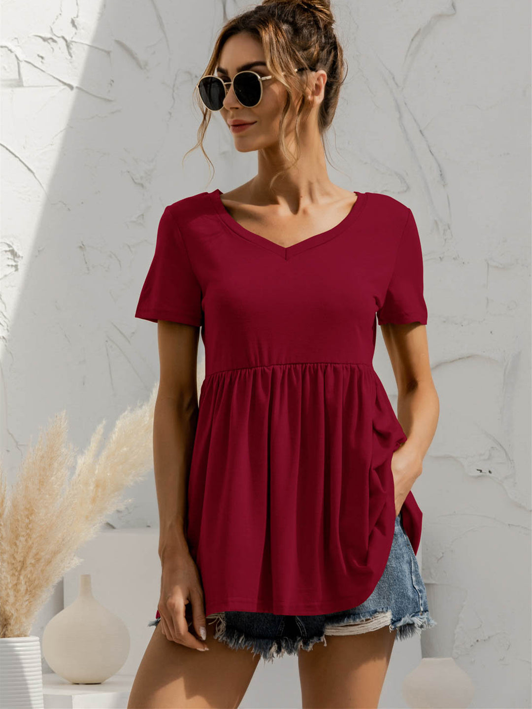 Burgundy V-neck babydoll top with short sleeves and empire waist