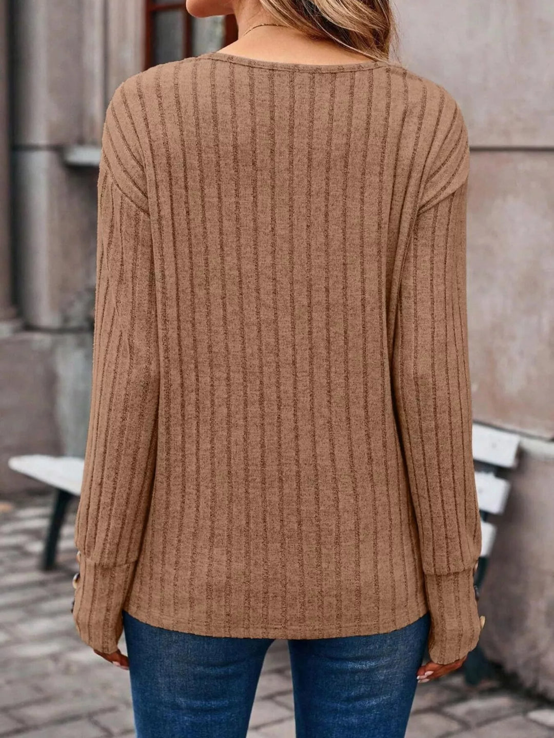 Ribbed knit V-neck top with buttoned cuffs