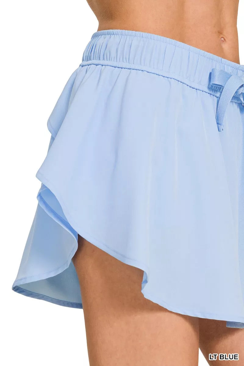 Active woven skort with drawstring waist and pockets