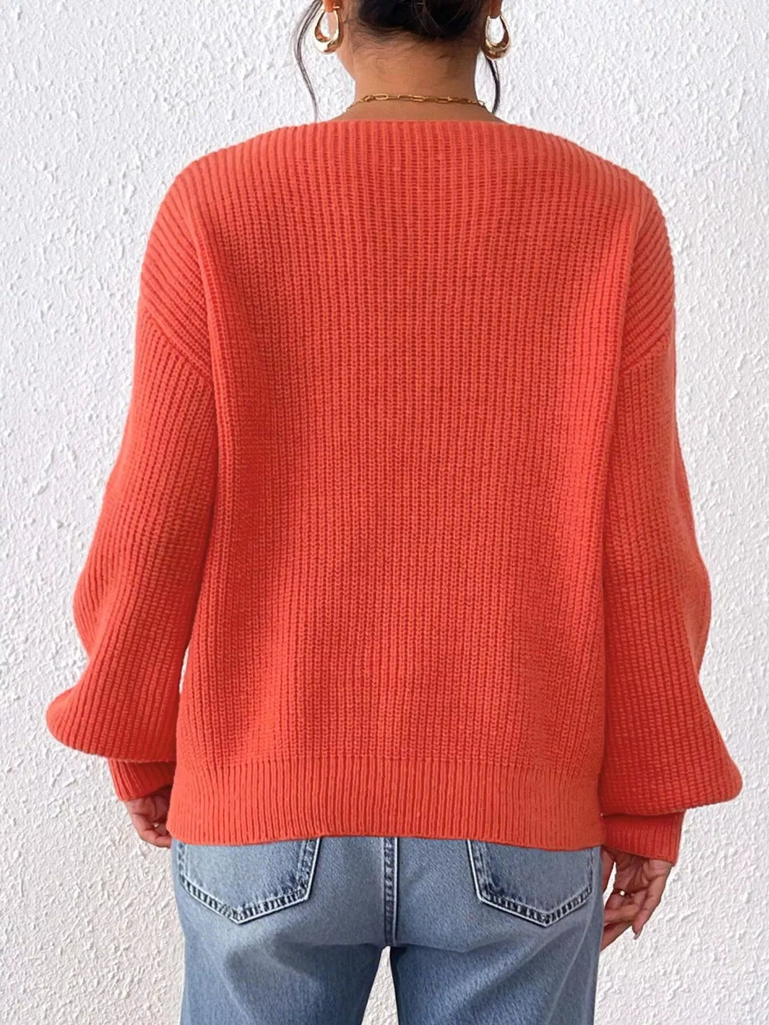 Ribbed knit V-neck sweater with bow-tie sleeves