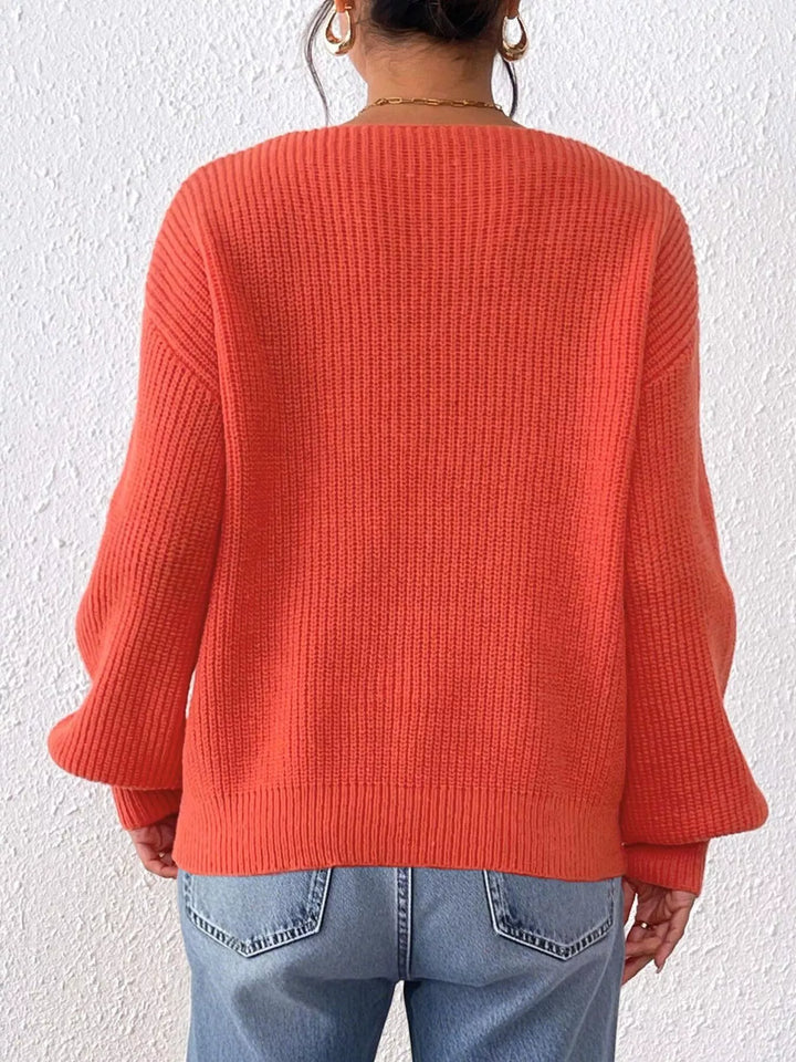 Ribbed knit V-neck sweater with bow-tie sleeves