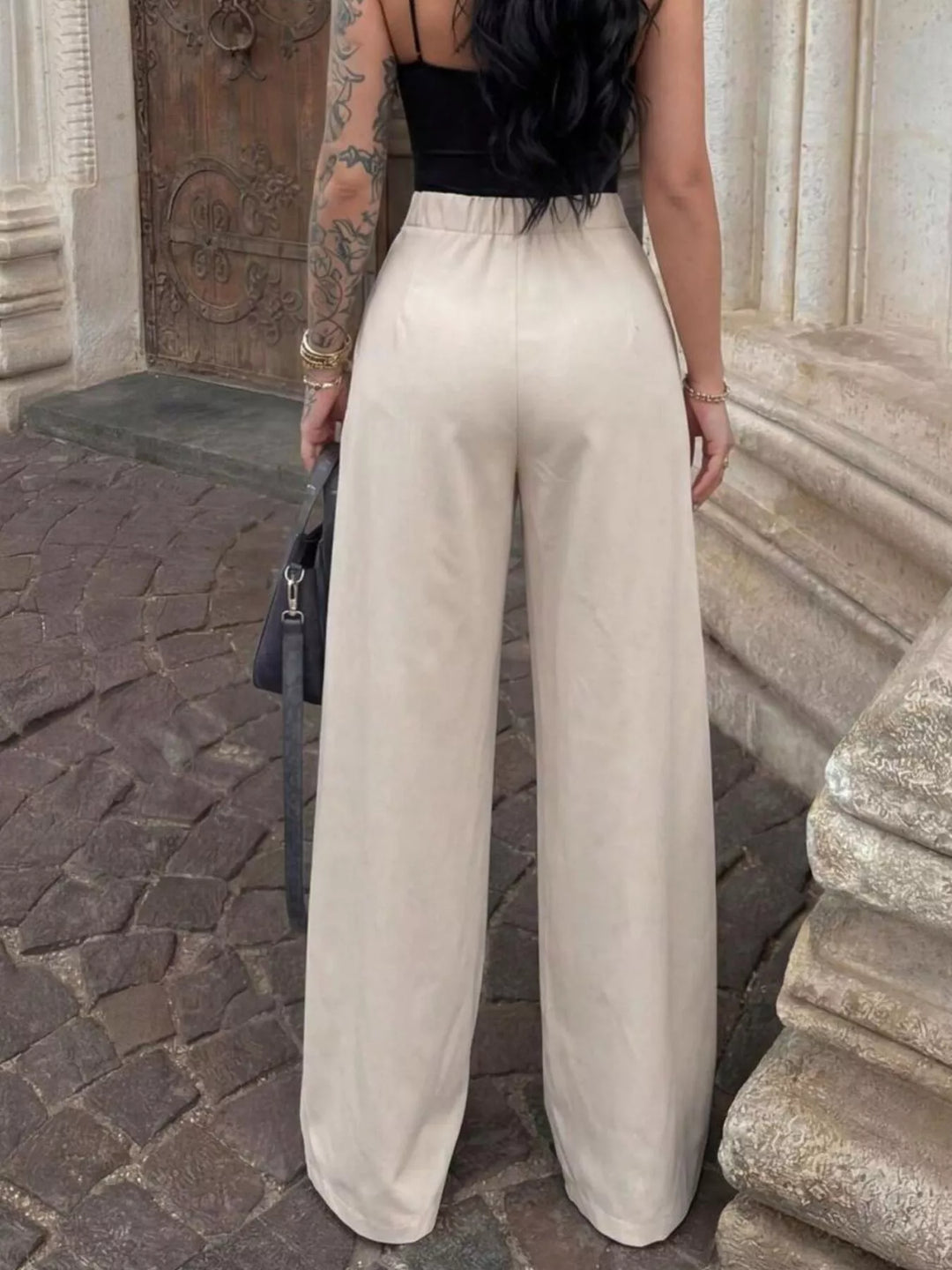 High-rise pleated wide leg pants with deep front pleats
