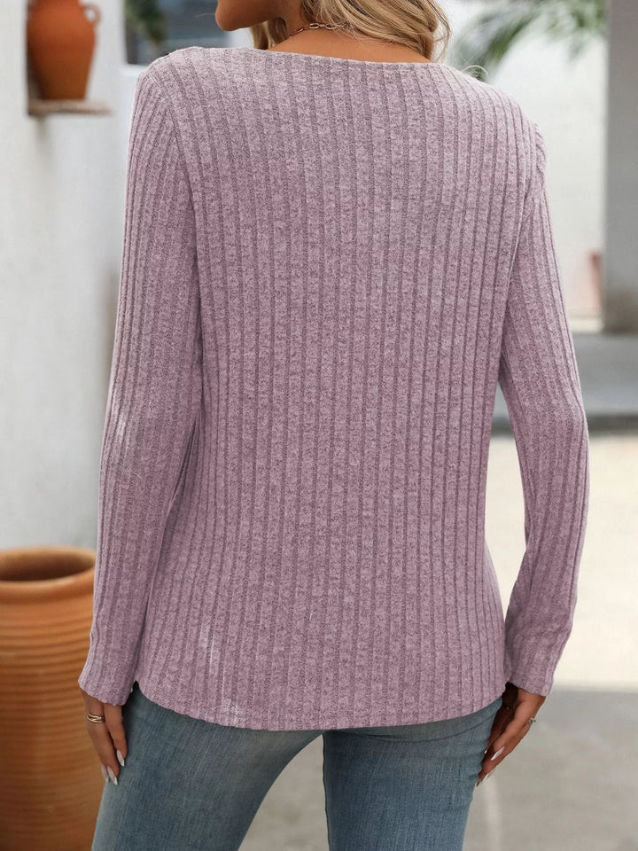 Ribbed knit long sleeve top with asymmetric button neckline