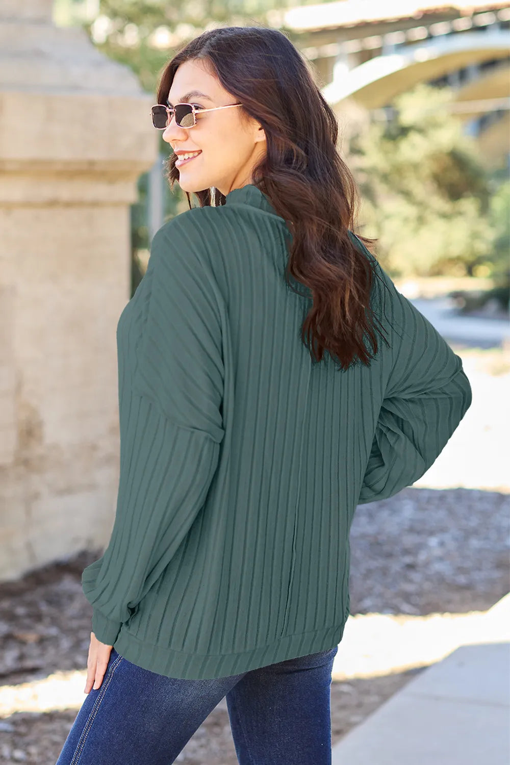 Ribbed exposed-seam mock neck knit top with drop shoulders