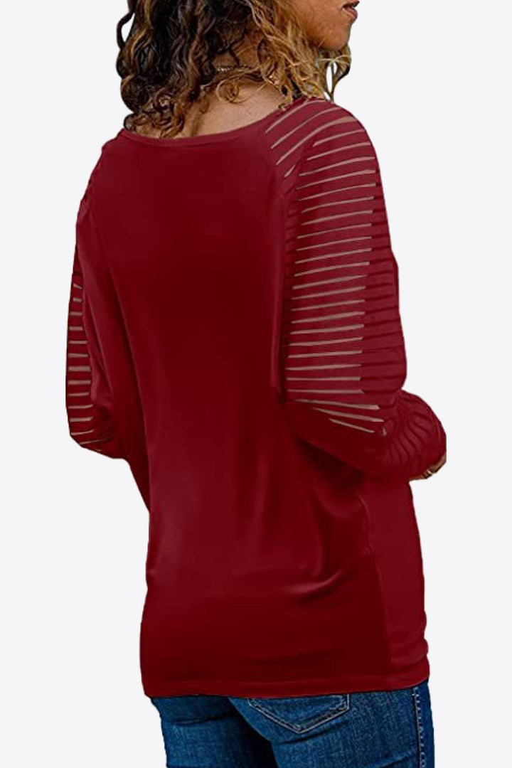 Semi-sheer striped raglan sleeve V-neck top