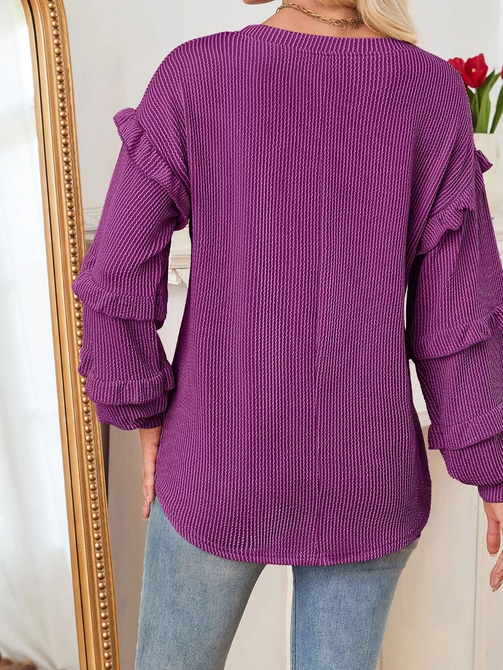 Ribbed knit top with ruffle-tiered long sleeves