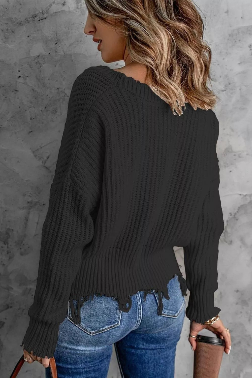 Distressed raw hem ribbed knit V-neck sweater
