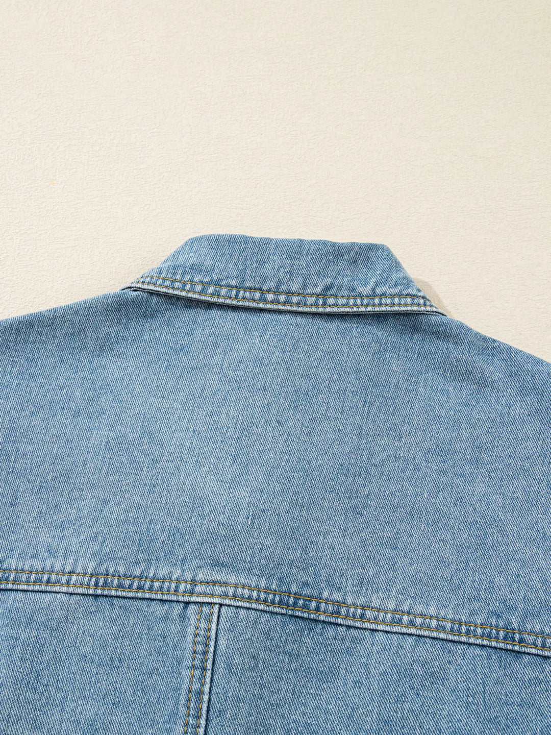 Oversized denim jacket with patch pockets and side ties
