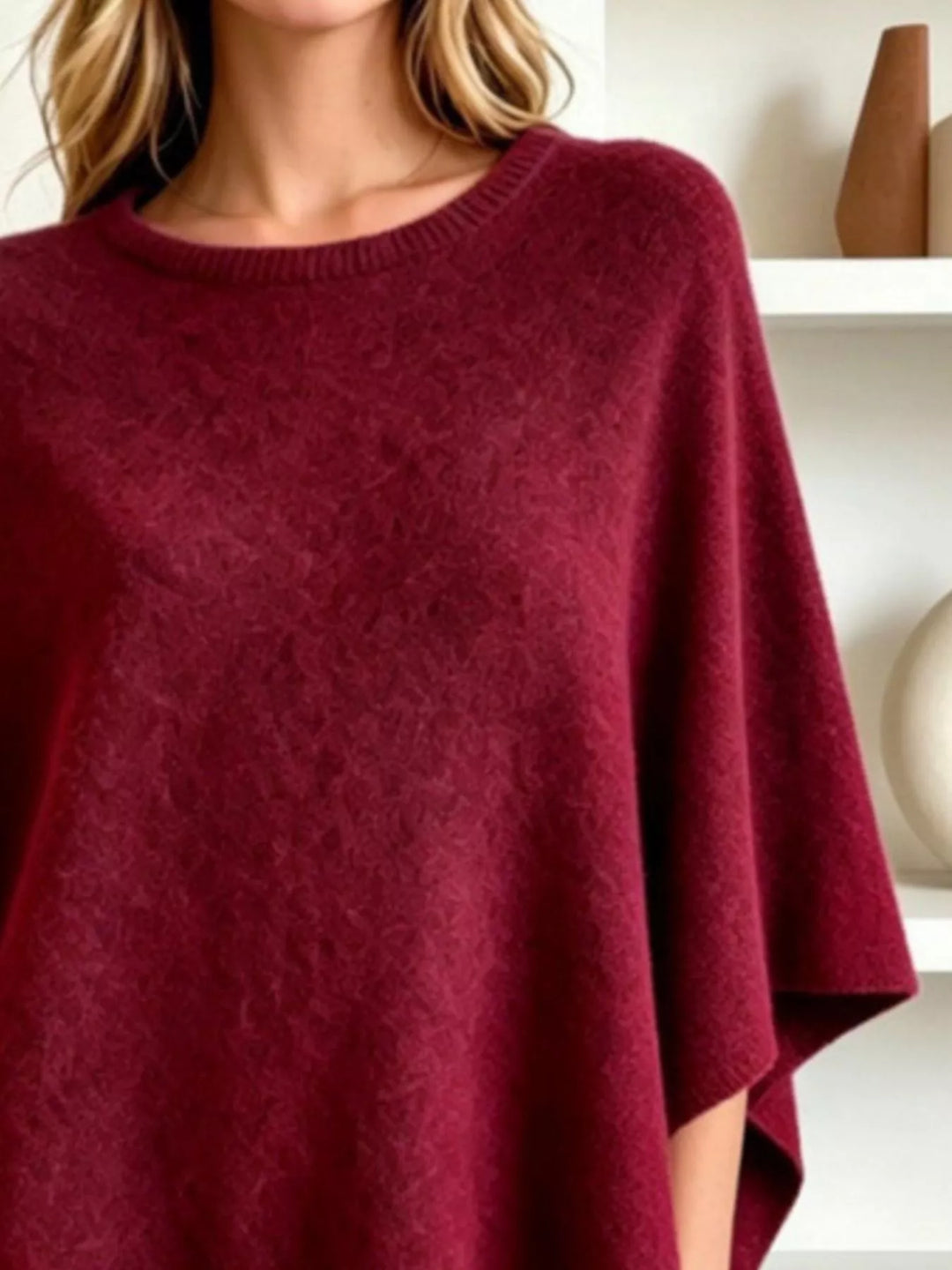 Asymmetrical hem textured knit poncho with ribbed crew neck