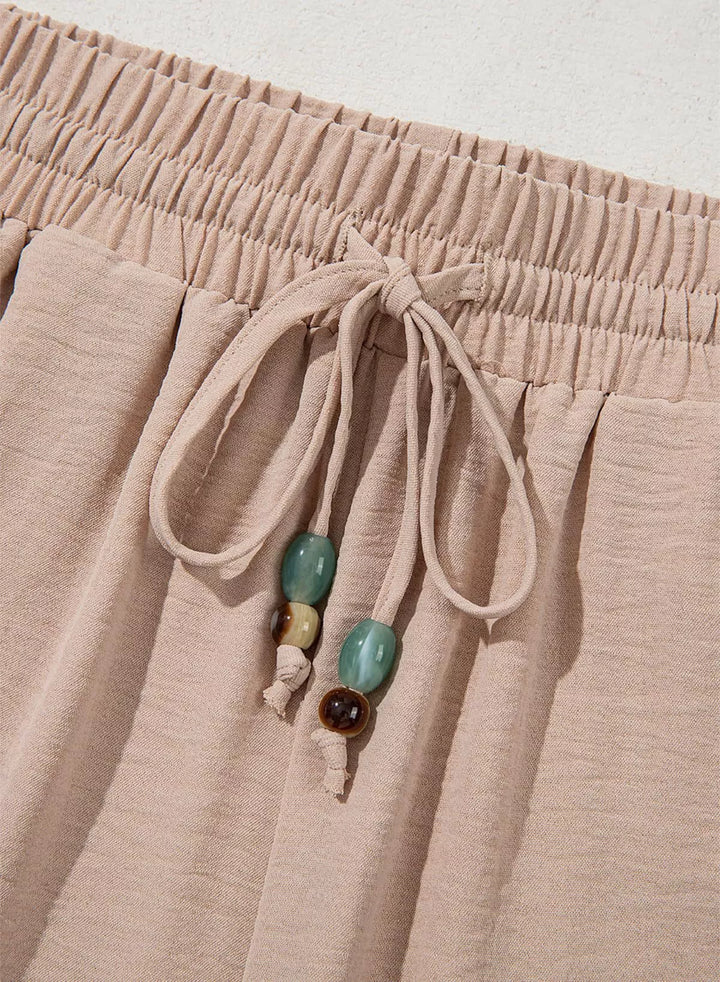 Wide leg drawstring pants with embroidered lace hem