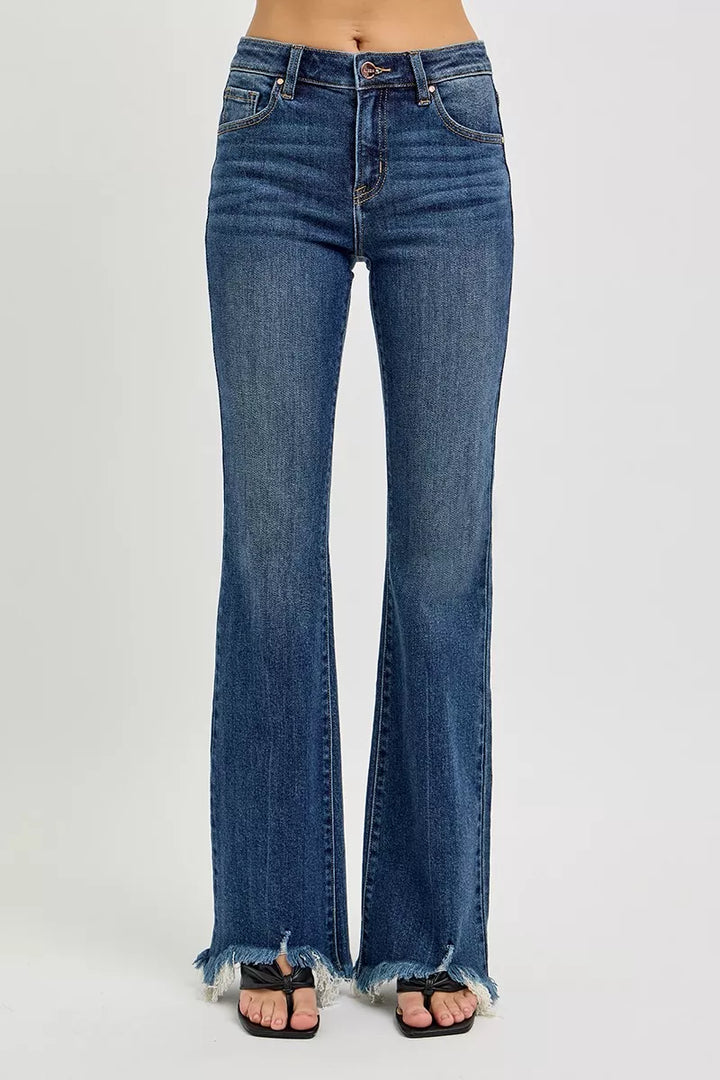 Mid-rise flare jeans with raw frayed hem in stretch denim