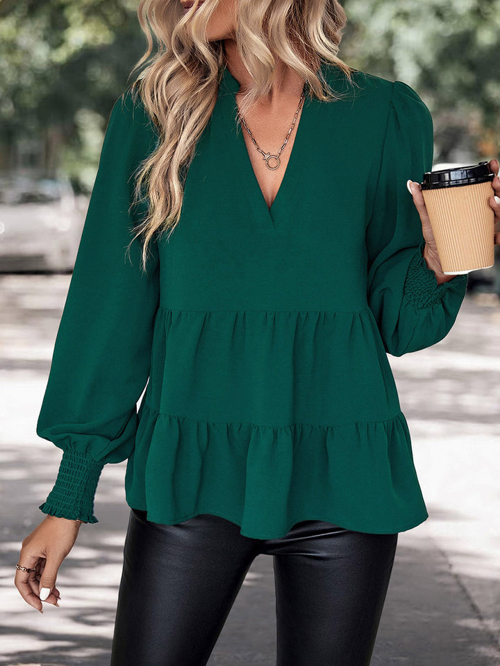 Green Tiered peplum blouse with notched neck and lantern sleeves