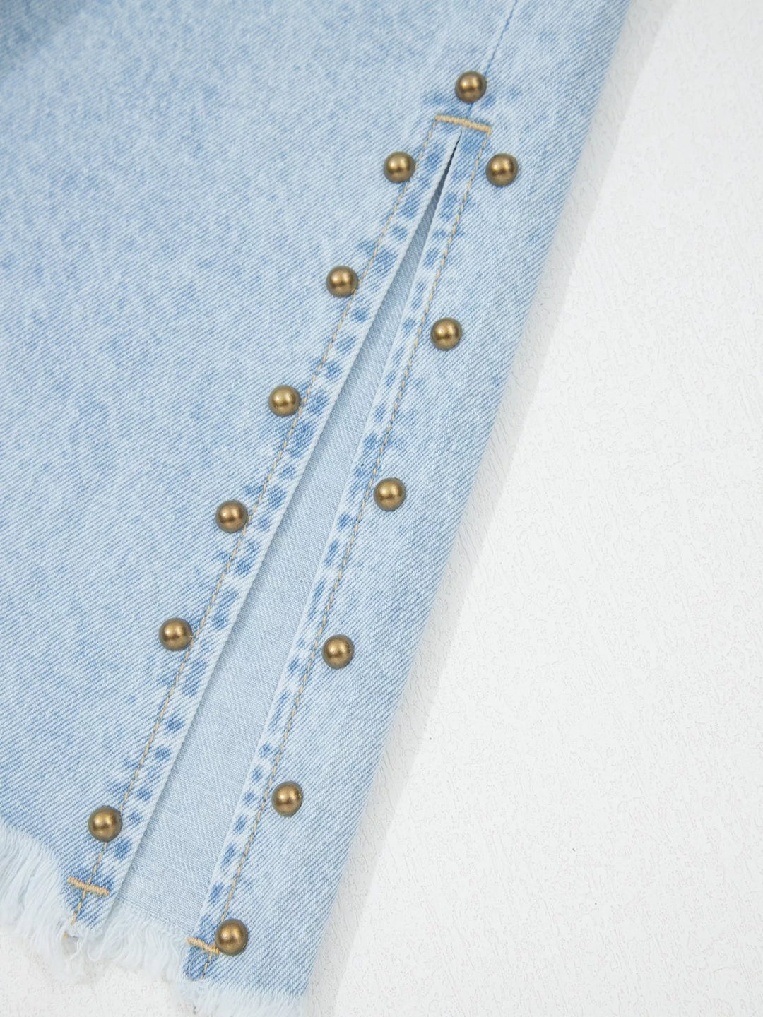 Studded wide leg jeans with side slits and frayed hem