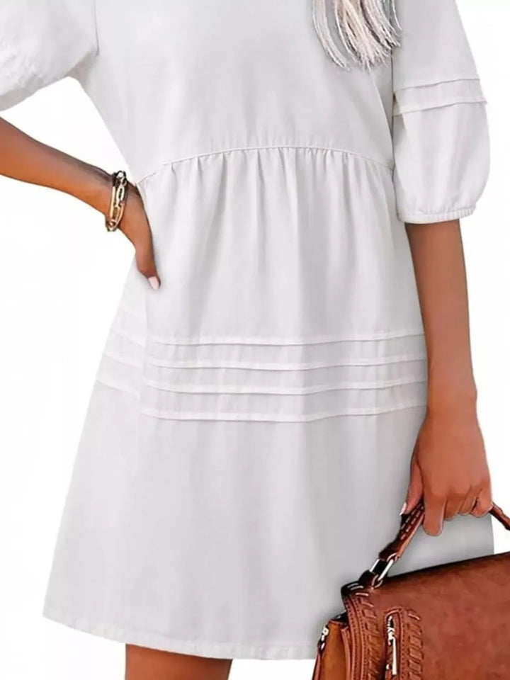 V-neck puff sleeve denim mini dress with pintuck pleating