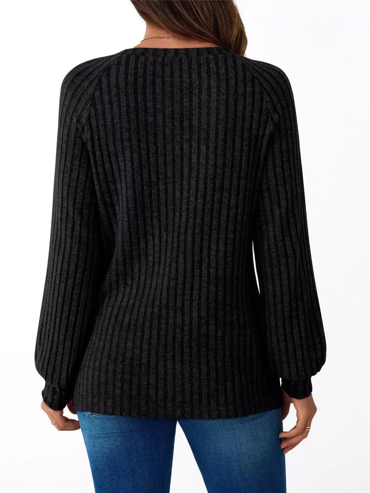 Ribbed knit long sleeve top with decorative shoulder buttons