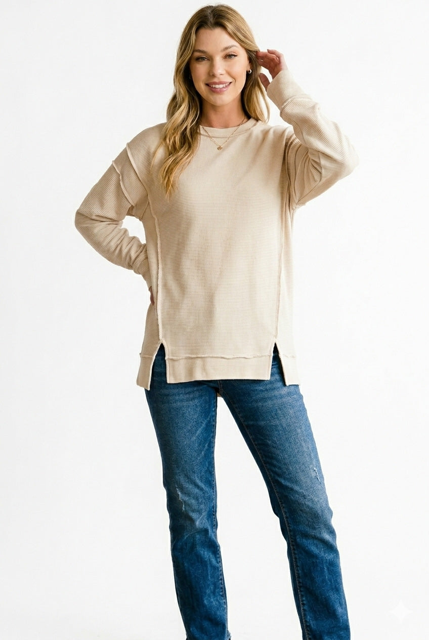 Ribbed exposed-seam pullover sweatshirt with side slits