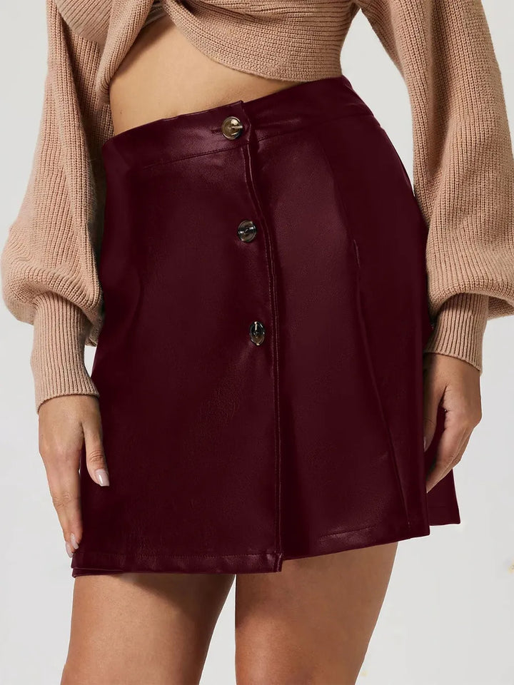 Faux leather high-rise mini skirt with button front detail