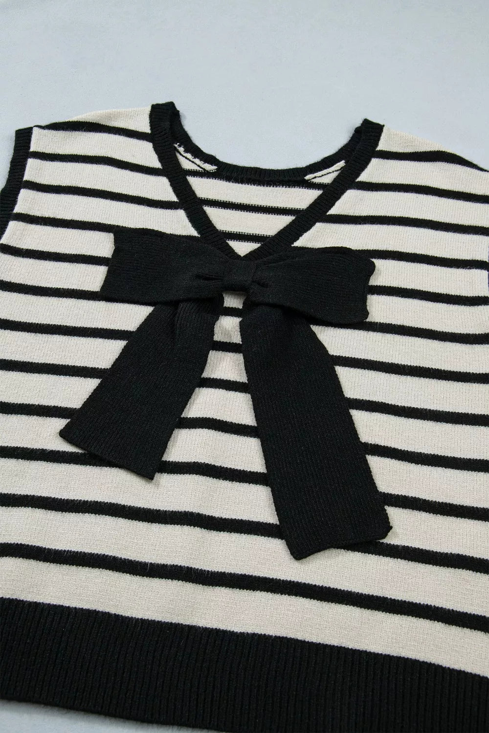 Striped short sleeve knit top with oversized bow